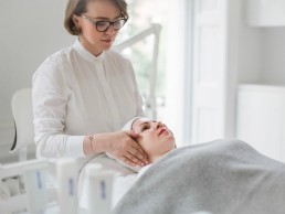 specialist preparing patient for microneedling treatment